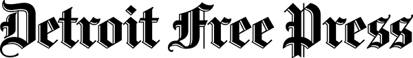The logo of the Detroit Free Press, featuring stylized text in black and white. The design is ornate, with flourished lettering, set against a transparent or light-colored background, typical of newspaper branding.