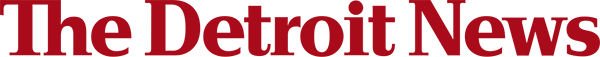 Logo of The Detroit News in red, featuring the words "The Detroit News" in a stylized font. The image has a white background, enhancing the visibility of the logo.